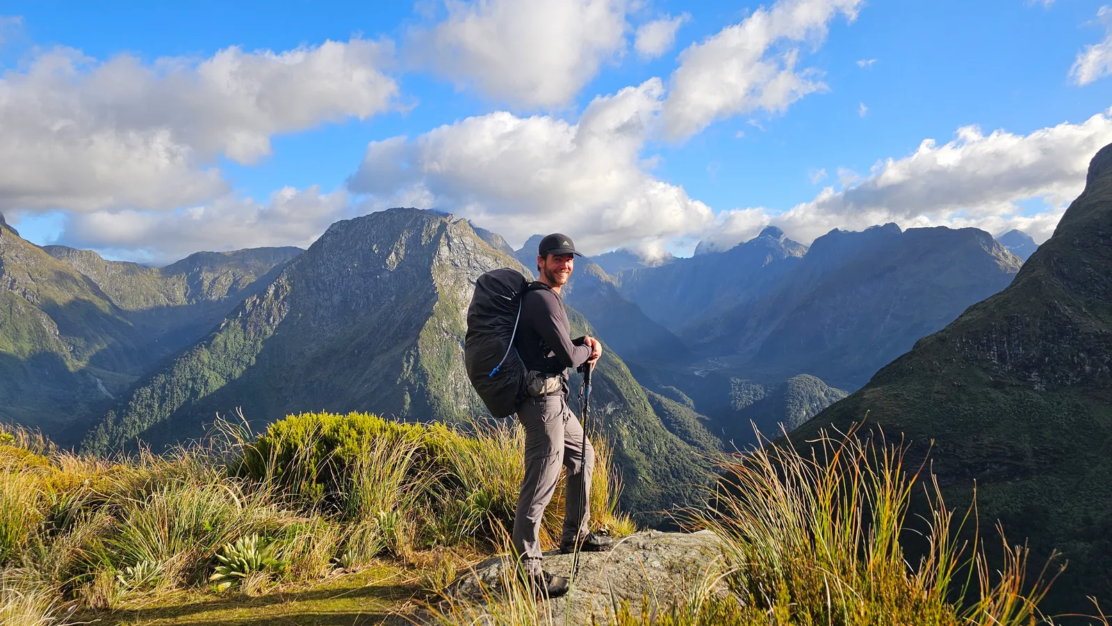 Vaughn Littlejohns hiking above a valley in New Zealand